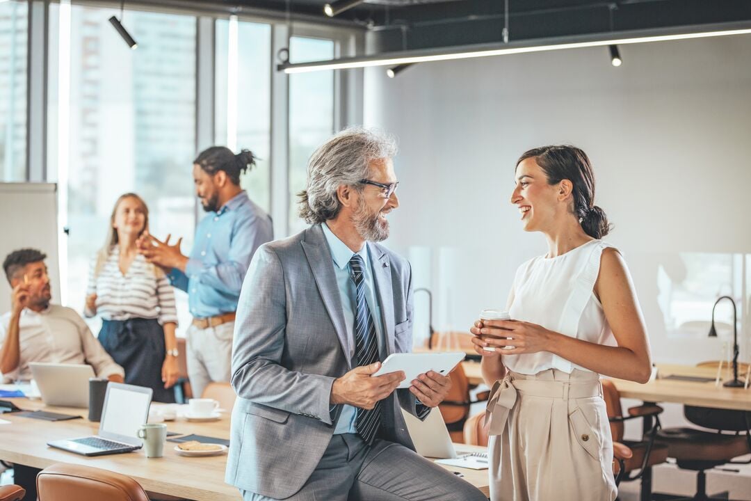 Web_Desktop-Colleagues Engaging in Discussion at Modern Office Meeting