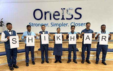 Web_Desktop-OneISS Group of people spelling out word crop